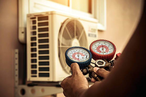 Professional Air Conditioning Service technician working in Catskill, NY